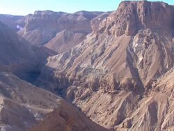 Aerial steep sided canyon in the Judea Desert, Israel Stock Footage