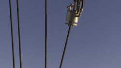A hook hangs from an oil rig over tanks on a platform. Stock Footage