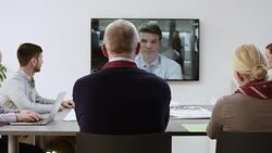 Construction project team in videoconference meeting with investor Stock Footage