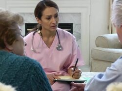 Latin Healthcare Professional Takes Notes rev Stock Footage