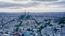Elevated view of the Eiffel Tower, city skyline and La Defence skyscrapper district in the distance, Paris, France, Europe - Time lapse Stock Footage