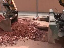 CU PAN Shot of workmen Engraving on street for works at sewage pipe / Saarburg, Rhineland Palatinate, Germany Stock Footage