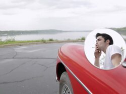 MS Young man standing next to car in rural area near river shore /  Bayport, Minnesota, United States Stock Footage