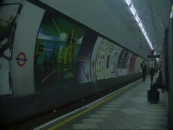 T/L People walking down platform of London Underground Tube station Stock Footage