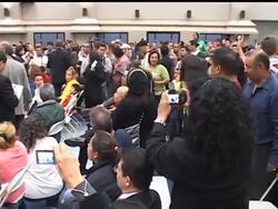 A crowd of more than 300 packed into a school near where a Guatemalan immigrant was shot and killed by a Los Angeles police officer Sunday, demanding answers from city officials. Authorities called for calm while they conduct an investigation. News Clip