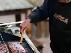 MS TU Senior man cooking ribs on his outdoor grill / Santa Fe, New Mexico, United States Stock Footage