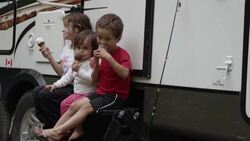 Children camping and eating ice cream Stock Footage