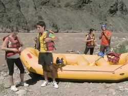 Young people preparing for white water rafting Stock Footage