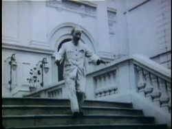 1956 B/W MS Ho Chi Minh being embraced by adoring children as he comes out of building / North Vietnam Stock Footage