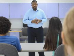 Teacher Interacting with Group of Students Stock Footage