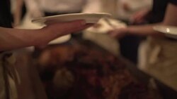 Chef cook dividing into portions baked ham at the party Stock Footage