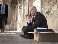 HD DOLLY: Unemployed Businessman On The Phone Stock Footage