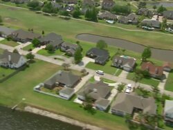 AERIAL MS T/S View of Residential area side of river / New Orleans, Louisiana, United States Stock Footage