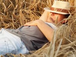 HD: Young Farmer Lying In Wheat Stock Footage