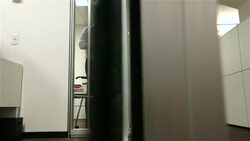 Fired employee leaves boss' office in disbelief, walks down office hallway toward camera Stock Footage