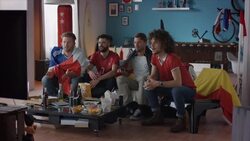 Sport fans sitting on couch watching tv disappointed Stock Footage