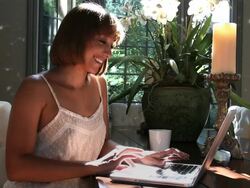 Woman video chats on laptop Stock Footage