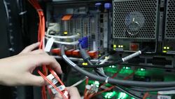 Administrator working in computer server room data center Stock Footage