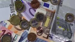 Different Euro banknotes with coins Stock Footage