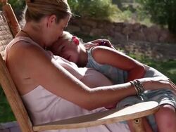 MS TU Shot of young girl resting on her pregnant mothers lapy / Phoenix, Arizona, United States Stock Footage