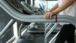 sport women jogging on treadmill cardio equipment Stock Footage