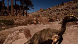 Dinosaurs confront each other during a stand off in a dusty, rocky field. . Stock Footage