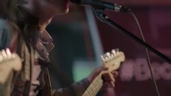 Passionate lead singer of rock band plays guitar and screams into microphone Stock Footage