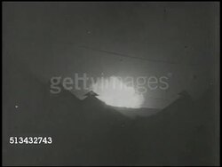 1944: U.S. MILITARY AIRBASE: NIGHT: VS Explosion at night, silhouette of airbase building roofs, damaged &amp; burning U.S. Air Force aircrafts, fighter planes, smoke, fire, burning. World War II, WWII, airstrike, air raid, Japanese raid, bombing Instructional Video