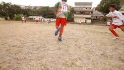 Young Brazilian soccer player dodges attack and passes ball to teammate during scrimmage match Stock Footage
