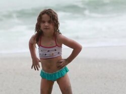 MS TS Little girl doing dance moves on beach / Montezuma, Puntarenas, Costa Rica Stock Footage