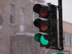 Traffic lights and it's snowing Stock Footage