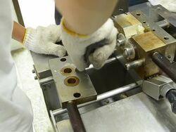 remove plastic compound out from front of internal mixer. Stock Footage