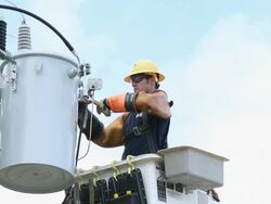MS LA  Man in Saftey Gear Attaching Power Line to Transformer Box / Oyster, Virginia, USA Stock Footage