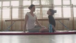 4K: Girl talking with her gymnastics coach. Stock Footage