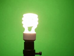 Hand Installs and Removes CFL then LED Light Bulb Stock Footage