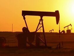 Oil Wells Pumping at Sunset Stock Footage