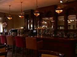 Old fashioned bar, oak furniture, stools and hanging lights, Lough Erne, Northern Ireland Stock Footage