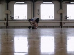 WS  young man practicing his dribbling of basketball inside  gymnasium / Minneapolis, Minnesota, United States  Stock Footage