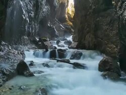 MS T/L ZI Shot of river passing through deep mountain gorge "Partnachklamm" / Garmisch Partenkirchen, Bavaria, Germany Stock Footage