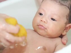 Baby taking a bath Stock Footage