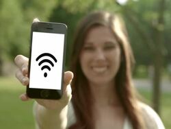 Smart phone with wifi in the park young woman Stock Footage