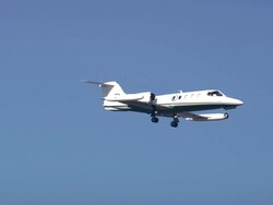 Aerial CU TS air to air with Lear Jet / Los Angeles International Airport, California, United States Stock Footage