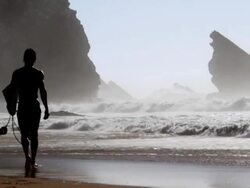 Surfer walking at the beach Stock Footage