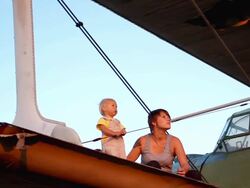 woman with a child and an old airplane Stock Footage