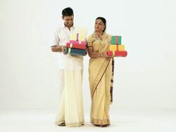 South Indian couple holding lots of gift box  Stock Footage