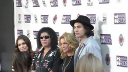 Gene, Nick, Sophie Simmons & Shannon Tweed on red carpet at Mending Kids Music On A Mission at Lucky Strike in Hollywood Stock Footage