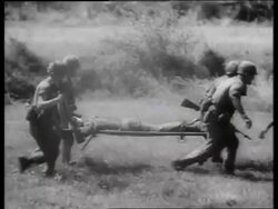 B/W 1960's soldiers carrying wounded man on stretcher / Vietnam / SOUND Stock Footage