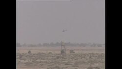 Cobra Helicopters and US Military Convoy Outside Safwan News Clip