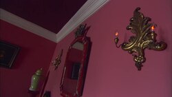Sconces glow on a pink wall in a hotel room at La Maison Hotel in Rio de Janeiro. Stock Footage