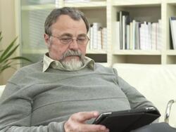 HD DOLLY: Senior Man Using Digital Tablet Stock Footage